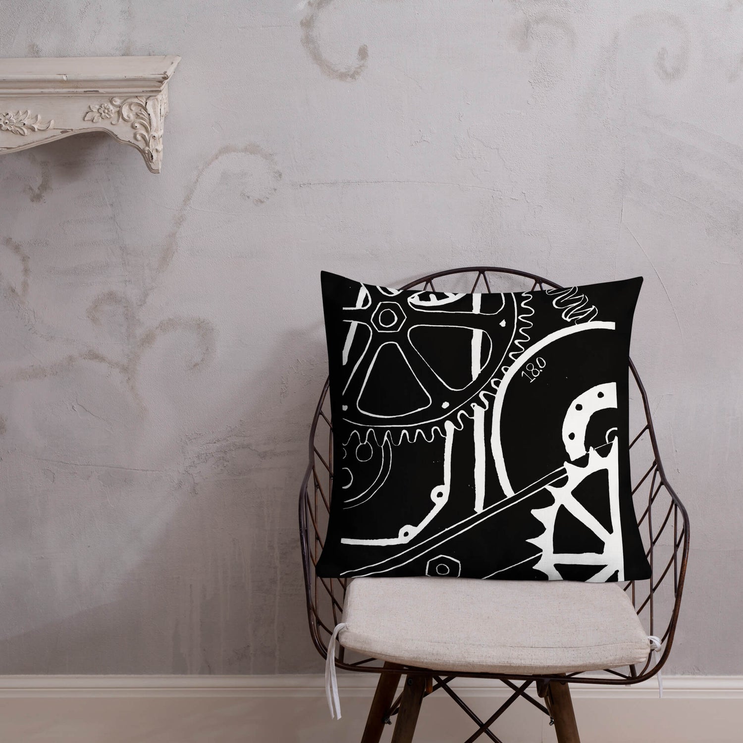 Cushion with a printed Mechanical Sketch digitally edited Lino Print in black on a chair. 